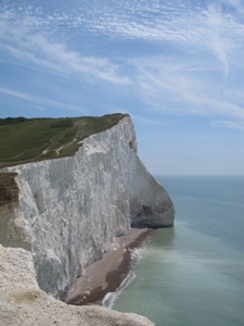 Side view of white chalks cliff of Dover and the sea.