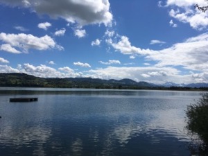 View across the Zurisee. Scattered clouds.