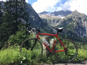 Red and white Condor bicycle in front of mountains