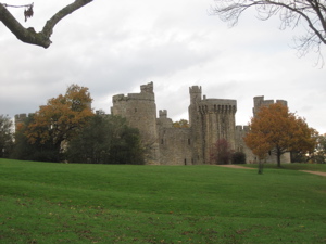 Bodiam Castle, surrounded by autumn trees