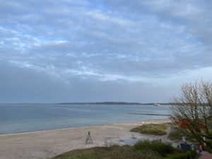 Sandy beach, under scattered cloudy in sky