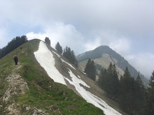 View over the peaks of hills, snow on the lee side