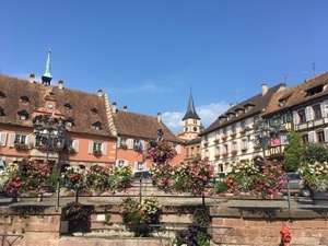 Pretty village square - medieval houses and flowers in boxes