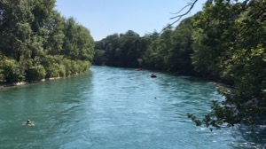 View along the river Aare, with inflatable boat and swimmers