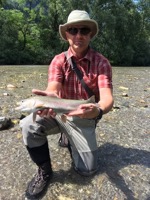 Me, holding a rainbow trout.