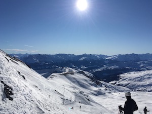 Snow covered mountains under a blue sky