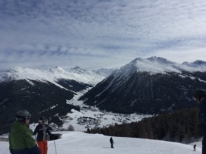 Ski slope, with snow covered mountains in the background