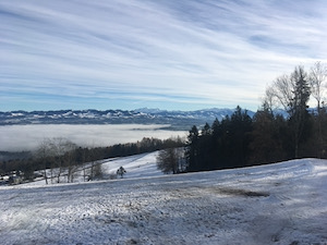 View of snow-capped mountains in sunshine.