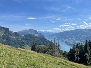 View over the Walensee with the Churfirsten in the background. Blue skies with light clouds in the distance.