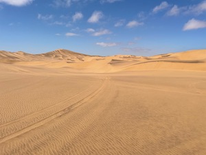 Dunes in the dessert, under a hot sky