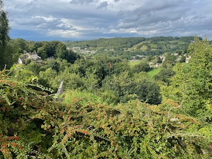 Views over the rolling, tree covered hills of the Cotswolds, near Burleigh.