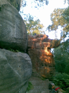 Short limestone cliffs, setting sun catching one edge.