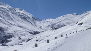 View up the valley from the snowshoe path in Realp. Blue Skies and snow covered valley and peaks