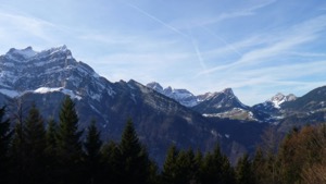 View over a valley to the Glarius range of mountains